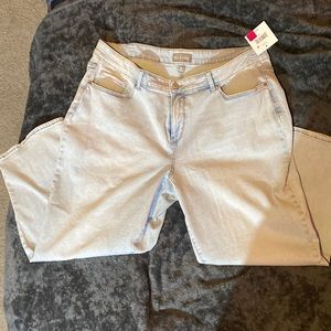 Light and dark blue jeans, purple and green shirt. Plus size.